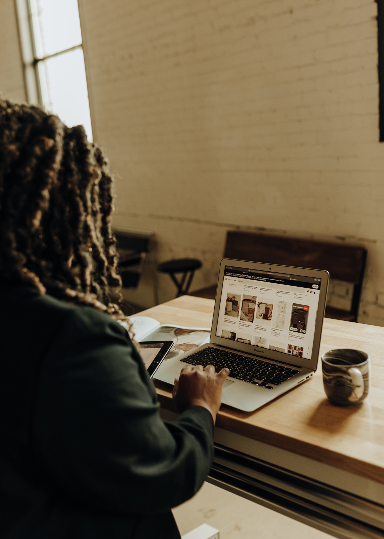LR Design Company reviewing a website on a laptop